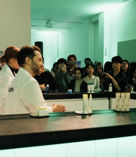 Guests watching a Dr.Jart+ skincare talk at the beauty counter
