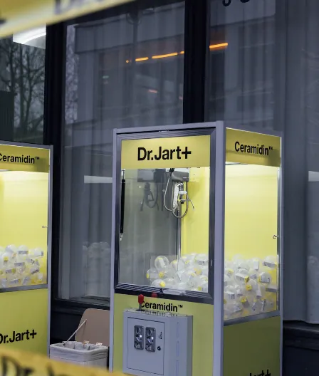 Yellow Dr.Jart+ Ceramidin claw machine outside the venue