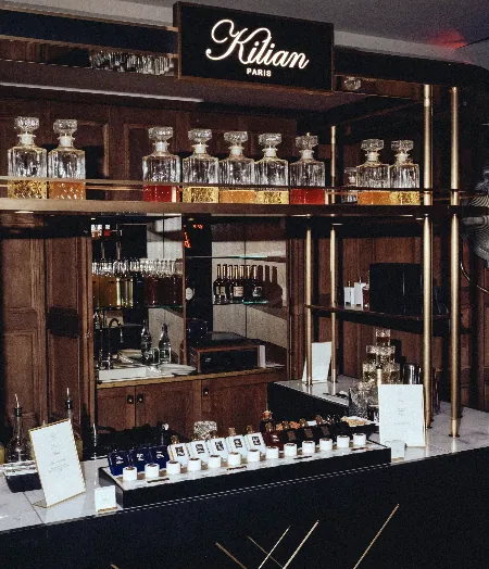 Custom Kilian PARIS bar with fragrance bottles and cocktail service