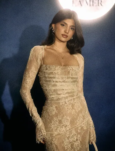 Guest wearing a cream lace look at the LA MER event